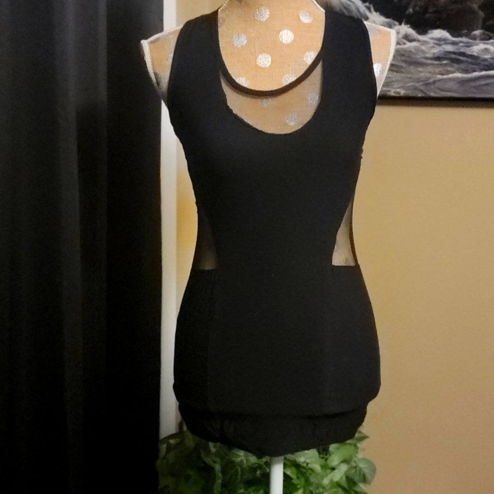 Sexy black mini dress with sheer sides and decollete